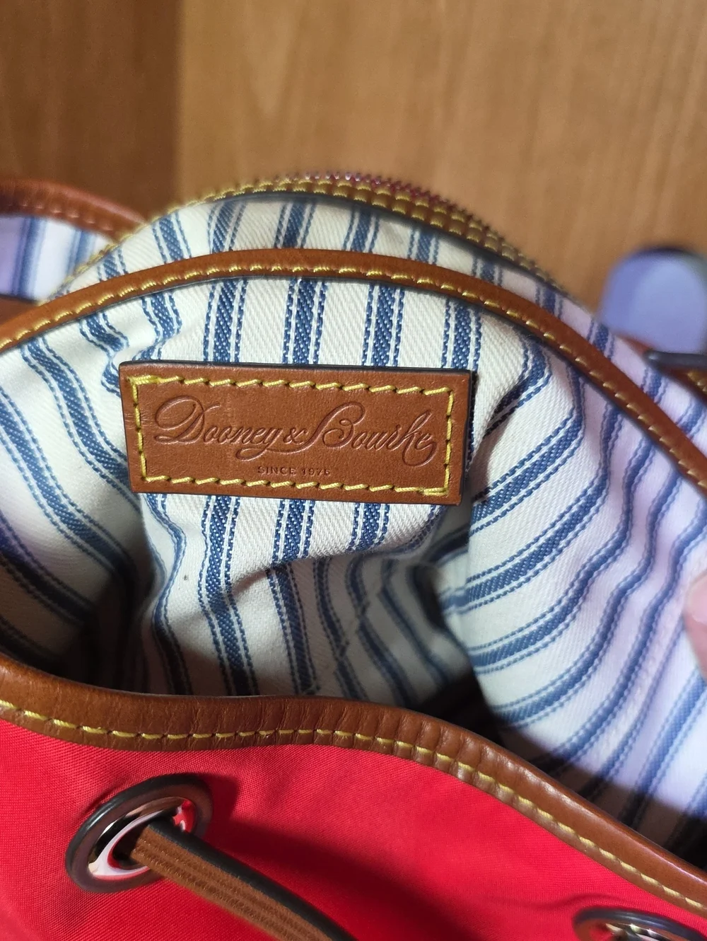 Dooney & Bourke Red Drawstring Bucket Bag with Brown Trim